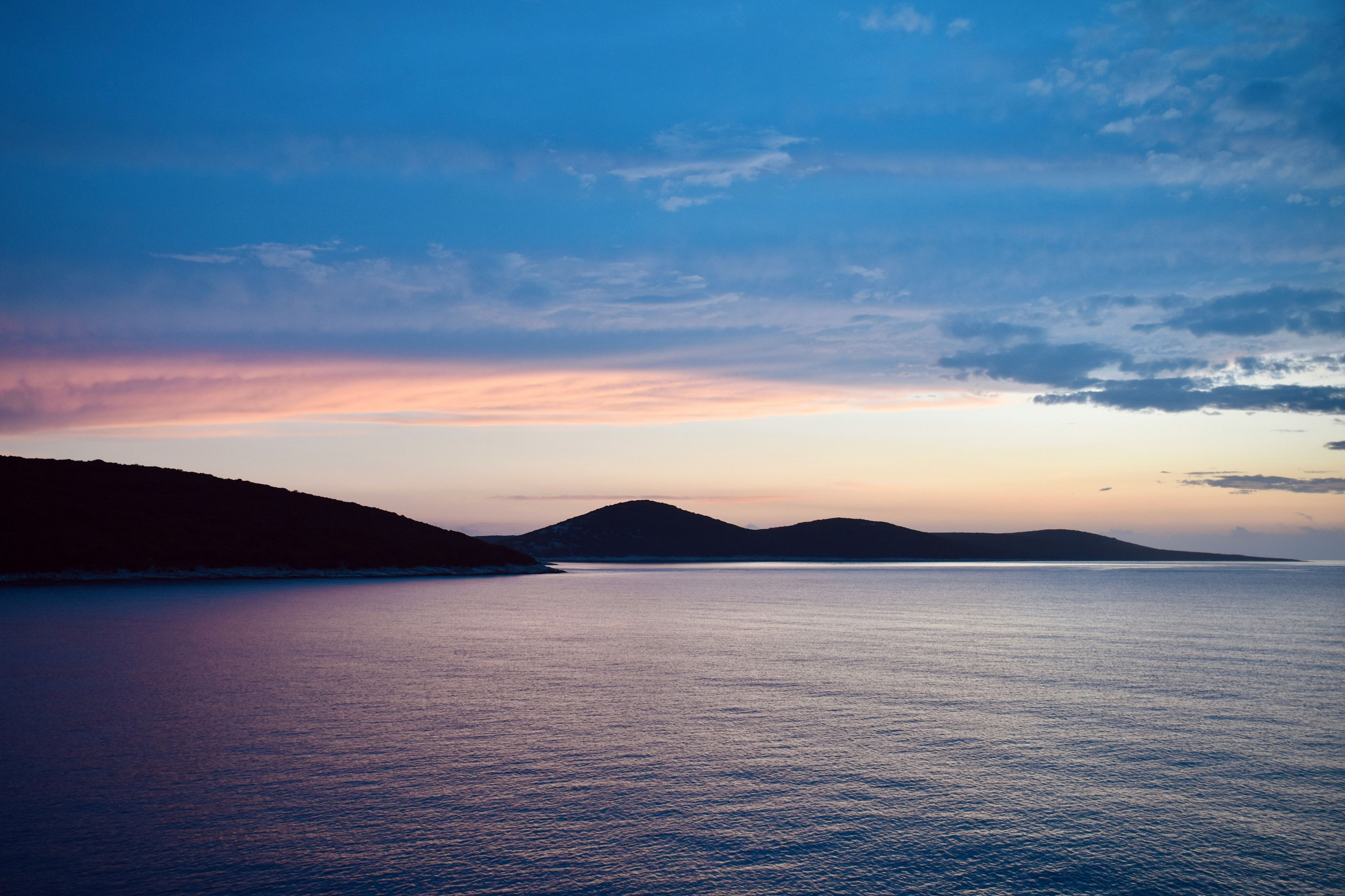 body of water under blue sky during daytime